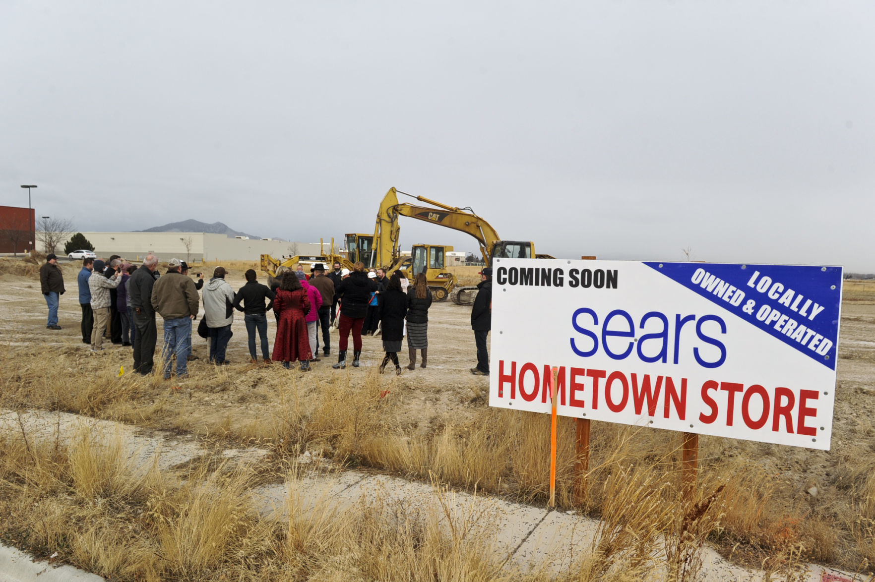 A crowd gathers at the site of the future Sears Hometown